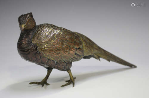 A Japanese brown and gilt patinated bronze figure of a pheas...