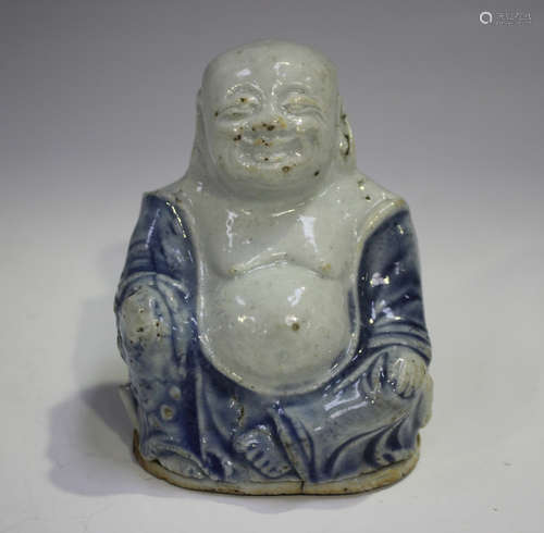 A Chinese blue and white glazed biscuit porcelain figure of ...