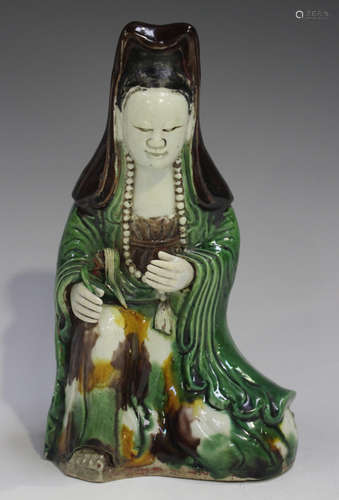 A Chinese famille verte enamelled biscuit porcelain figure o...