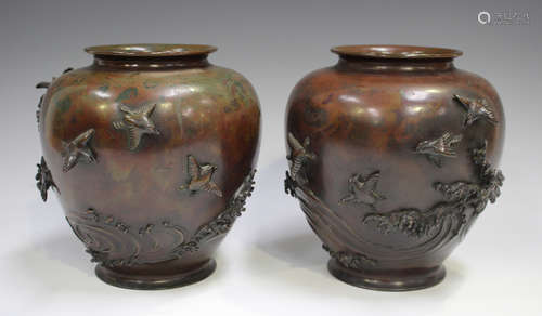 A pair of Japanese brown patinated bronze vases, Meiji perio...