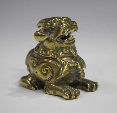 A Chinese polished bronze scholar's paperweight or scroll we...