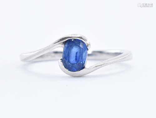 9CT WHITE GOLD AND SAPPHIRE CROSSOVER RING