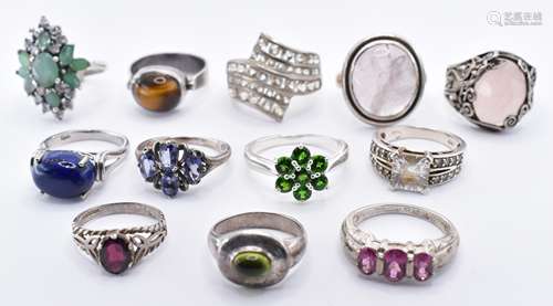 TWELVE SILVER STONE SET RINGS