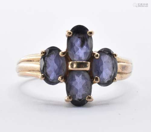 9CT GOLD AND PURPLE FOUR STONE RING