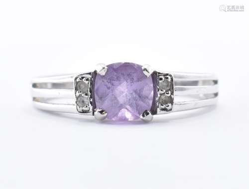 9CT WHITE GOLD AND PURPLE STONE RING