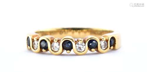 18KT GOLD DIAMOND AND BLUE STONE RING.