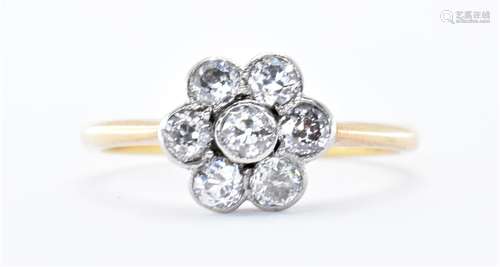 18CT GOLD AND DIAMOND SEVEN STONE RING