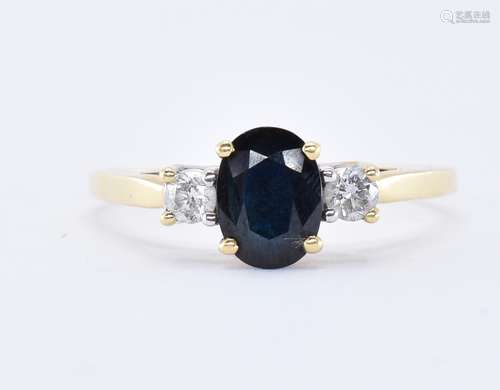 18CT GOLD DIAMOND AND BLACK STONE RING.