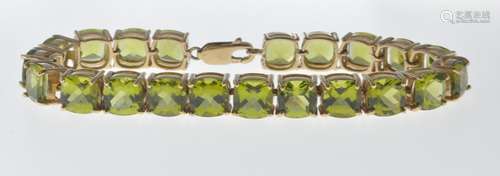 9CT GOLD AND PERIDOT LINE BRACELET