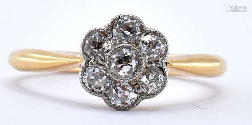 18CT GOLD AND DIAMOND FLOWER HEAD RING