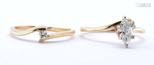 TWO 14CT GOLD CROSSOVER RINGS
