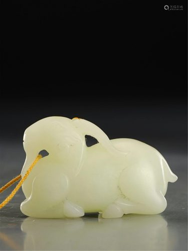 A WHITE JADE GOAT CARVING