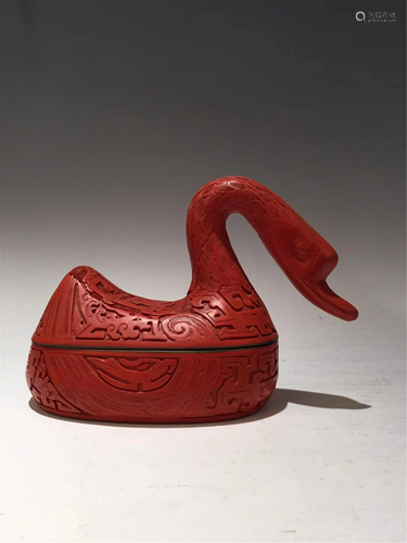 A CARVED RED LACQUER GOOSE SHAPED BOX