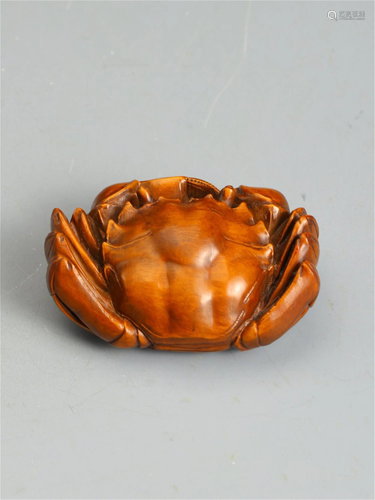 A HARDWOOD CARVED CRAB