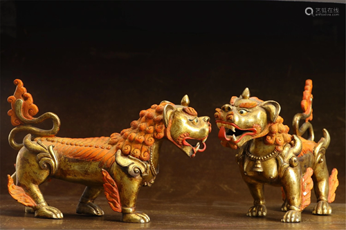 PAIR OF GILT BRONZE LION DECORATIONS