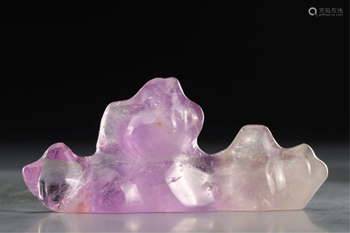 A MOUNTAIN SHAPED PURPLE CRYSTAL BRUSH REST