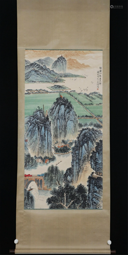 A CHINESE SCROLL PAINTING OF LANDSCAPE AND FIGURES