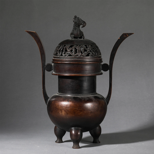 A BRONZE CENSER WITH DOUBLE HANDLES