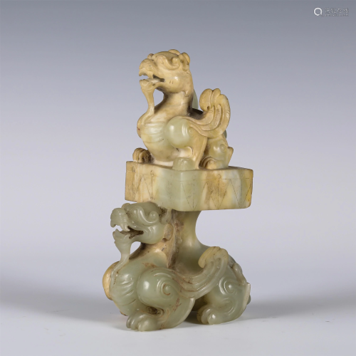 A JADE CARVING OF MYTHICAL BEASTS