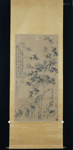 A CHINESE SCROLL PAINTING OF BAMBOO, ORCHID AND ROCK