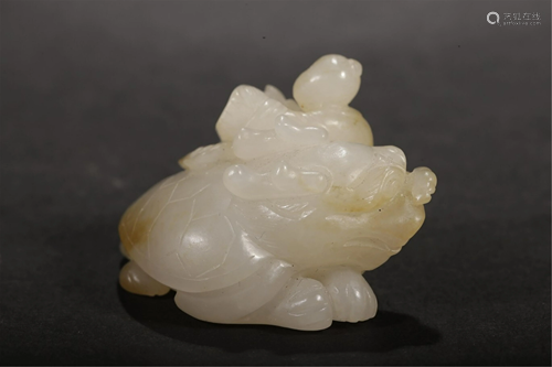 A WHITE JADE CARVING OF KID AND TURTLE