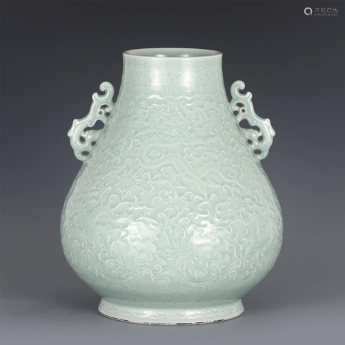 A PEA GREEN GLAZE INCISED DRAGON ZUN VASE