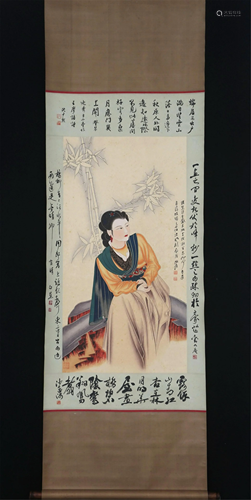 A CHINESE SCROLL PAINTING OF LADY AND BAMBOO