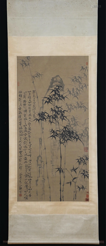 A CHINESE SCROLL PAINTING OF BAMBOO AND ROCK