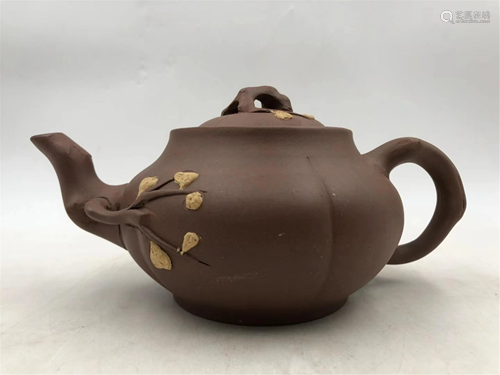 A CARVED PLUM BLOSSOMS YIXING CLAY TEA POT