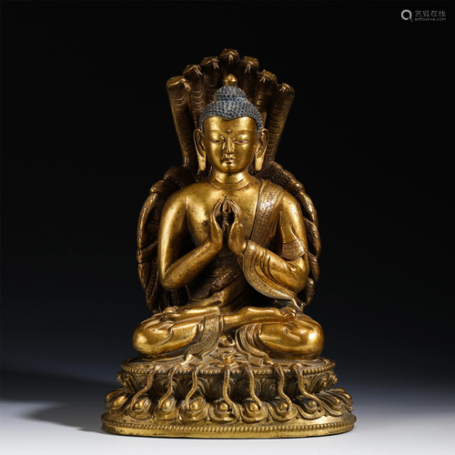 A BRONZE GILT SEATED SAKYAMUNI