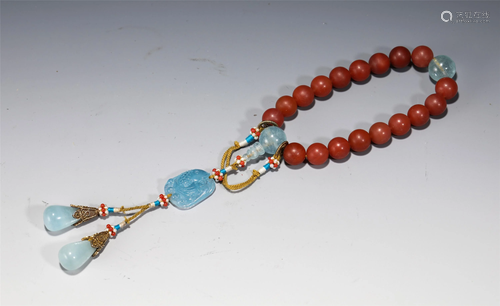 A STRING OF NANJIANG RED PRAYER BEADS