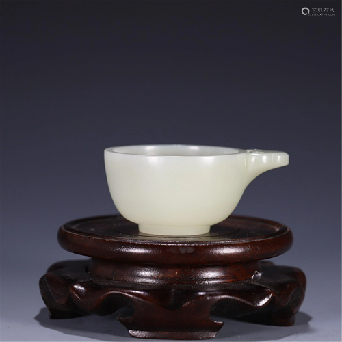 A CARVED JADE CUP WITH ONE HANDLE