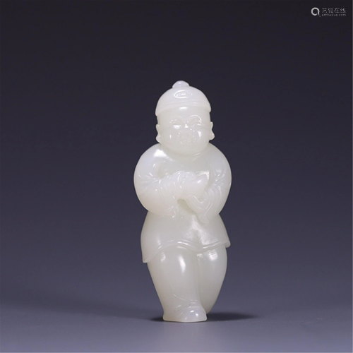 A JADE CARVING OF KID HOLDING AN INGOT