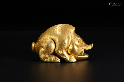 A GILT BRONZE MYTHICAL BEAST MAT-WEIGHT