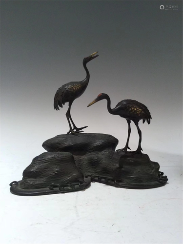 A BRONZE DECORATION OF TWO CRANES