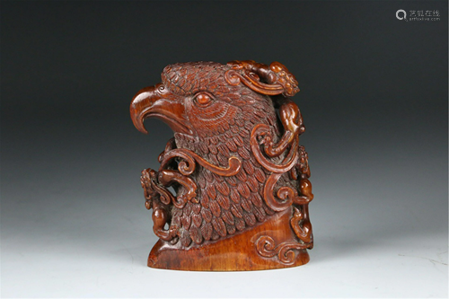 A CARVED GLASS EAGLE HEAD CUP