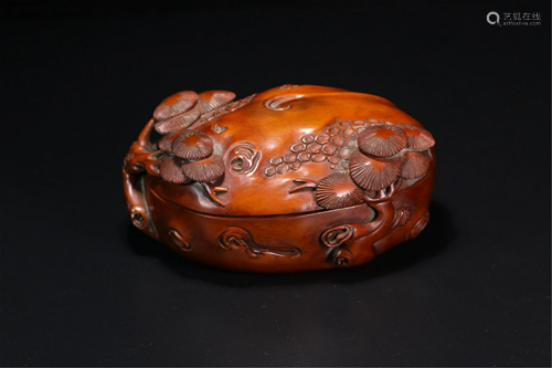 A CARVED PINE-TREE HARDWOOD BOX AND COVER