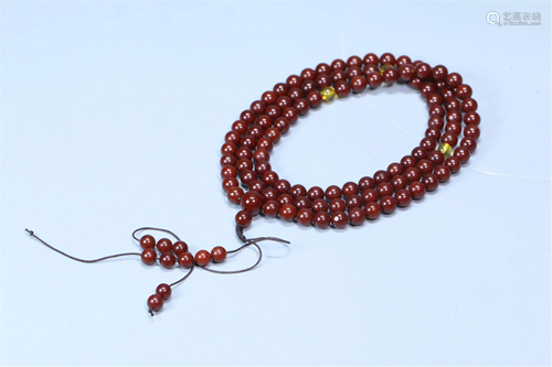 A STRING OF CLOUDY AMBER 108-BEAD PRAYER BEADS