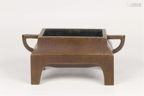 A BRONZE FOUR-FOOTED CENSER WITH DOUBLE HANDLES