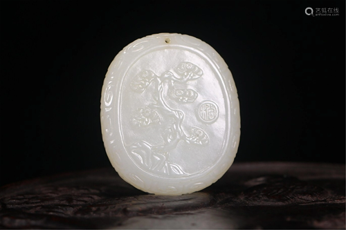 A JADE CARVED OVAL PENDANT