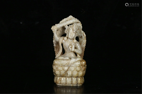 A CARVED JADE SEATED MANJUSRI BODHISATTVA