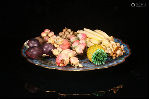 A CLOISONNE PLATE WITH CARVED DECORATIONS OF FRUITS