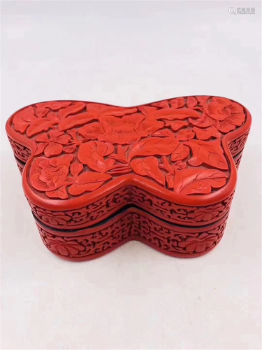 A CARVED RED LACQUER BUTTERFLY SHAPED BOX AND COVER