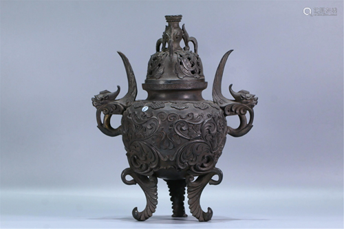 A BRONZE TRIPOD CENSER WITH DOUBLE HANDLES