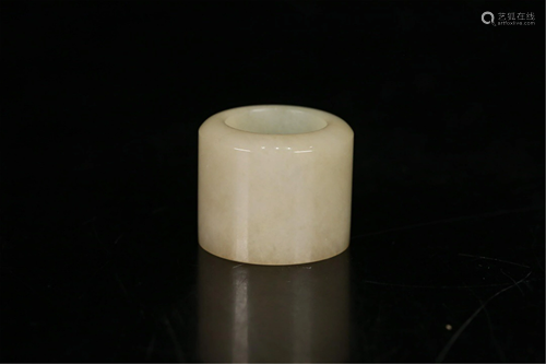 A CARVED JADEITE THUMB RING