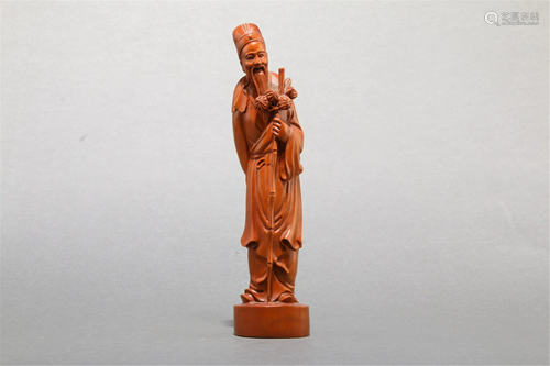 A HARDWOOD CARVING OF AN OLD MAN