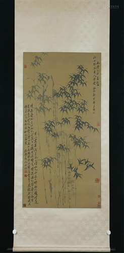 A CHINESE SCROLL PAINTING OF BAMBOO AND ROCK