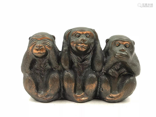 A BRONZE DECORATION OF THREE MONKEYS