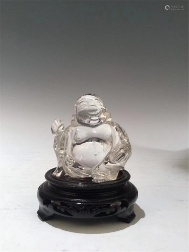 A WHITE CRYSTAL CARVED MAITREYA BUDDHA