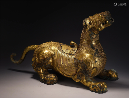 A BRONZE GILT MYTHICAL BEAST DECORATION